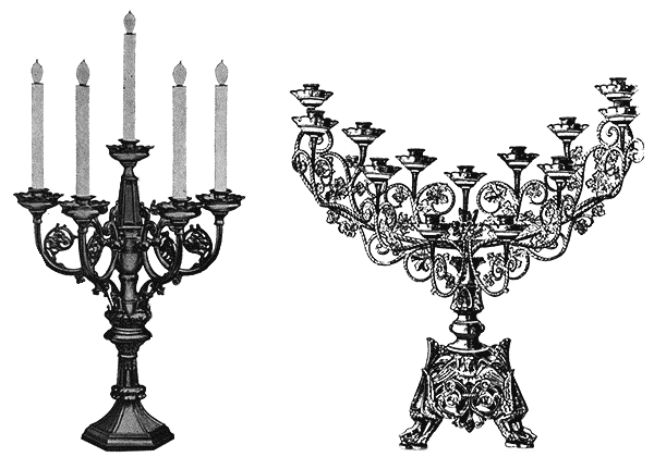 Three church candlesticks on altar candle stands inside the Church